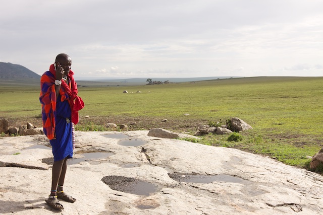 A Maasai elder talking by cellphone