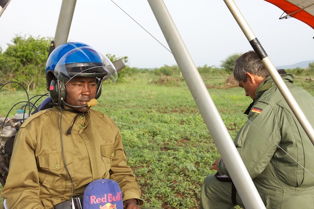 An anti-poaching game scout prepares to fly